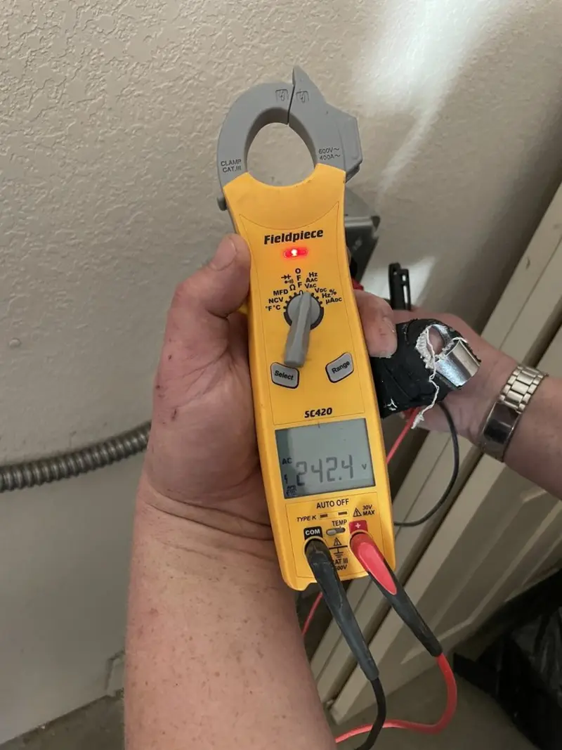 Voltage testing with clamp meter during Ceiling Fan Installation in Berea